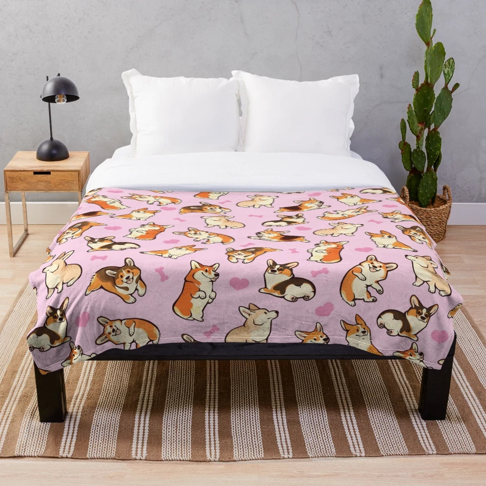 Soft and cozy plush blanket featuring a cute pattern of pembroke welsh corgis in pink