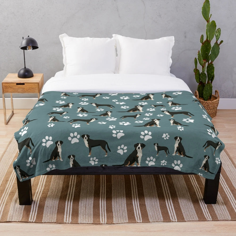 Plush gray blanket with greater swiss mountain dog paw print design