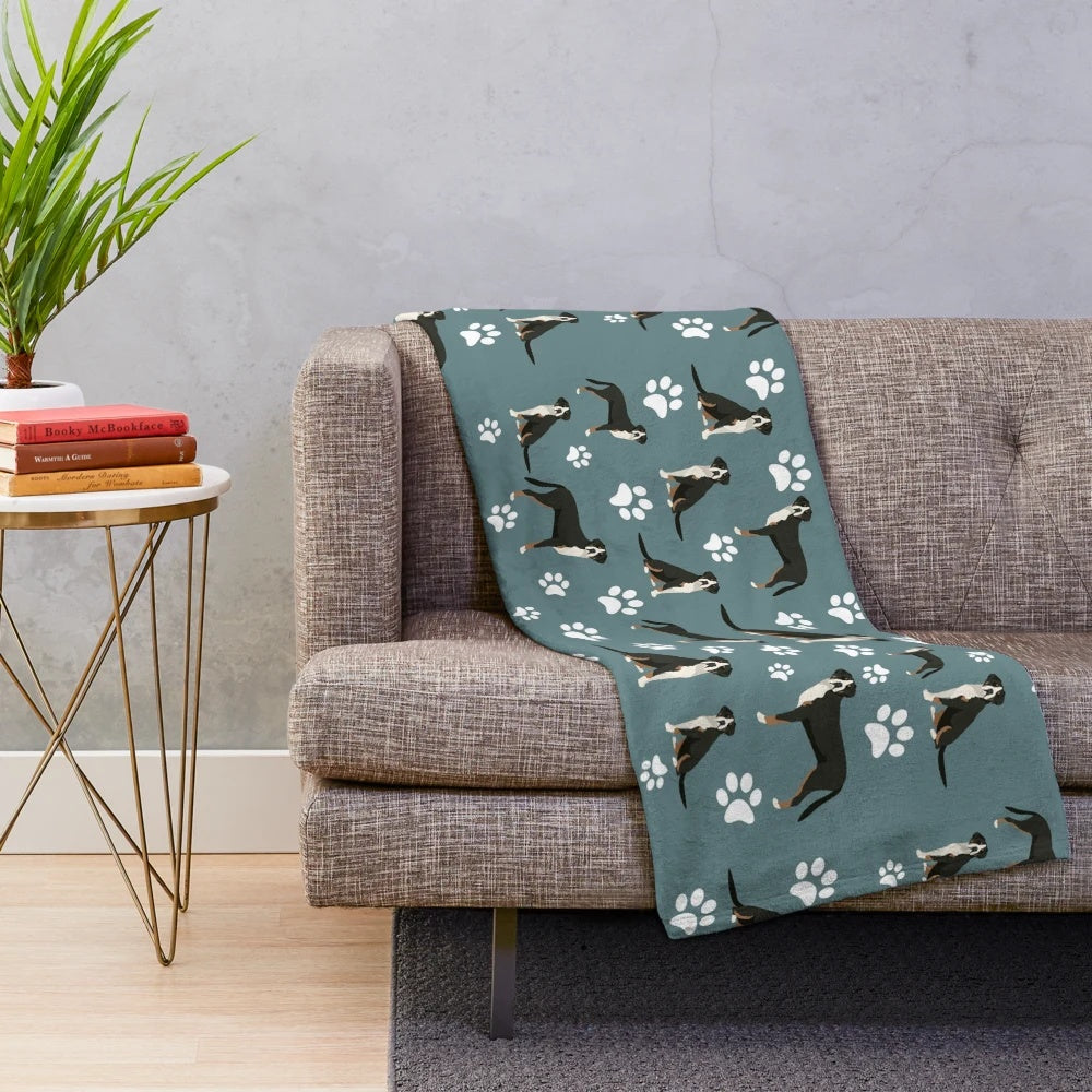 Plush gray blanket with greater swiss mountain dog paw print design