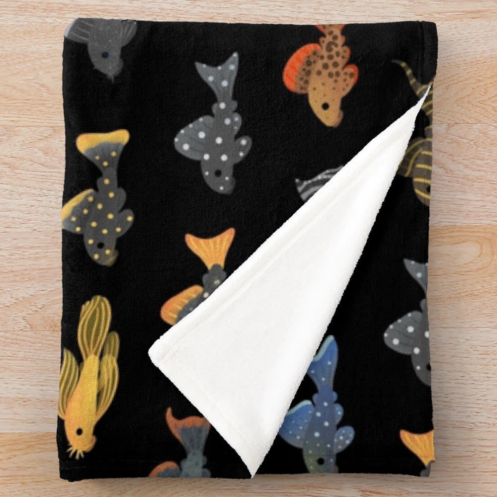 Black plush blanket featuring a plecostomus fish design