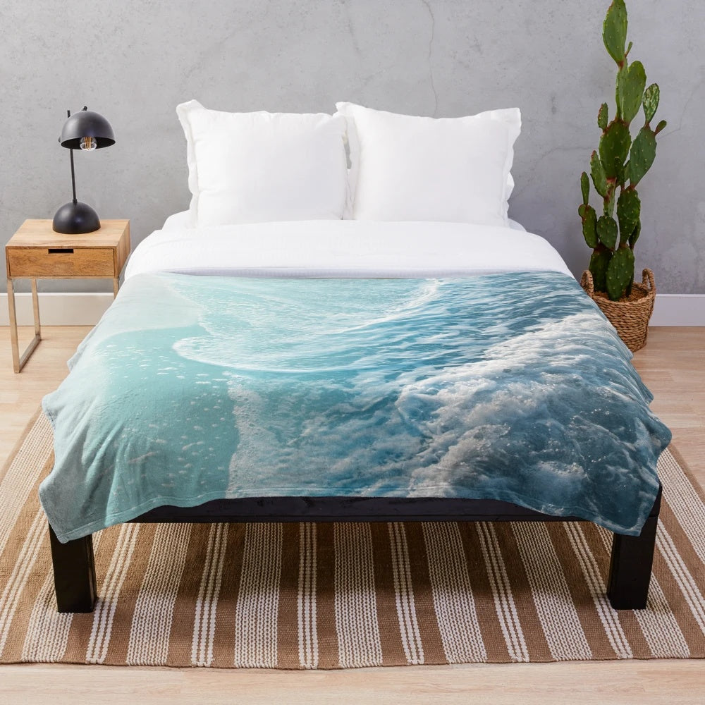 Soft plush turquoise ocean waves blanket for coastal home decor