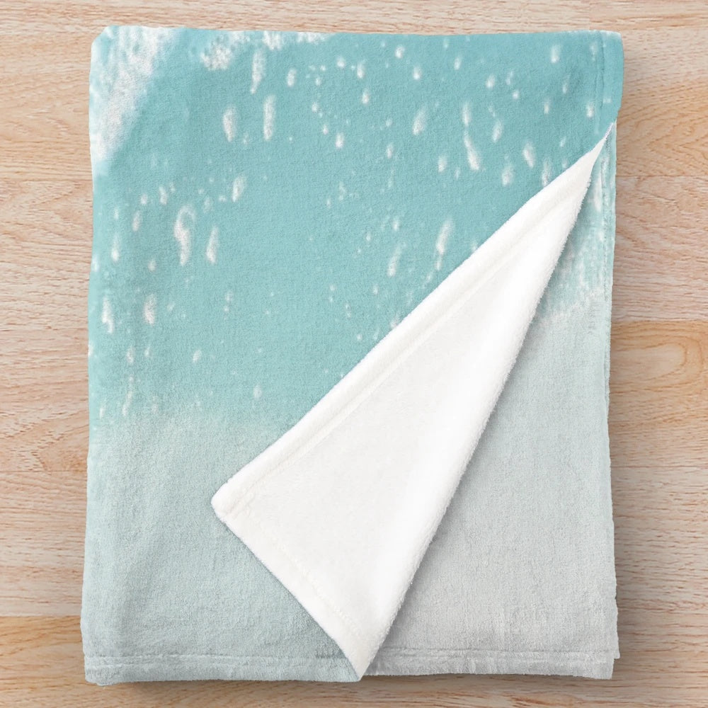 Soft plush turquoise ocean waves blanket for coastal home decor