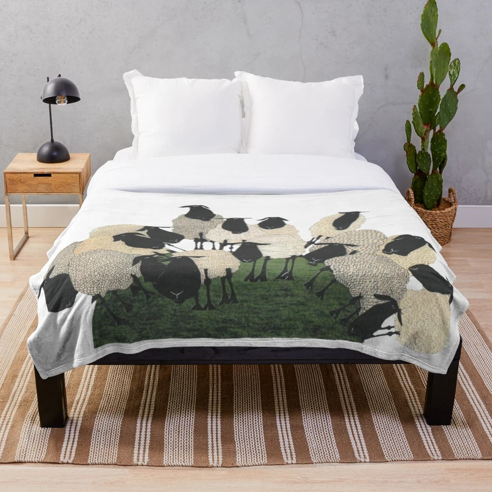 Soft and plush sheep-themed blanket with sheep on a hill design