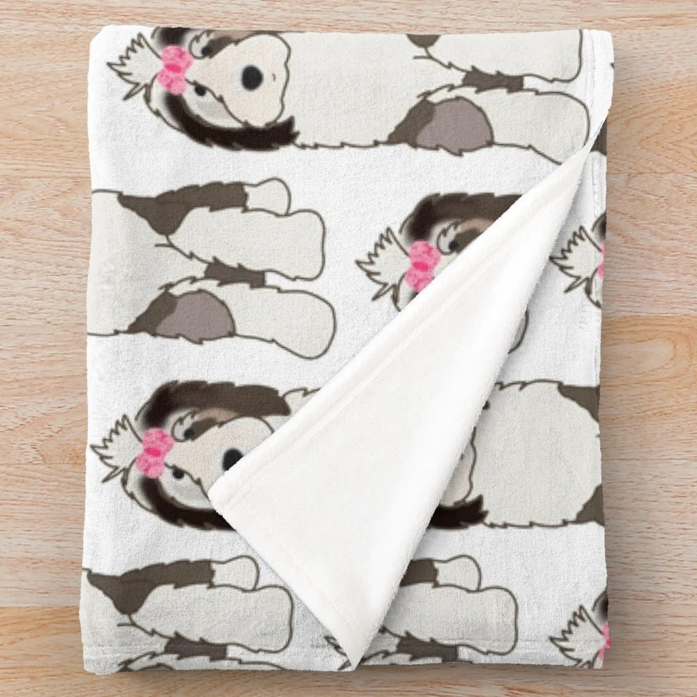 Sheepadoodle plush blanket with a cute bow