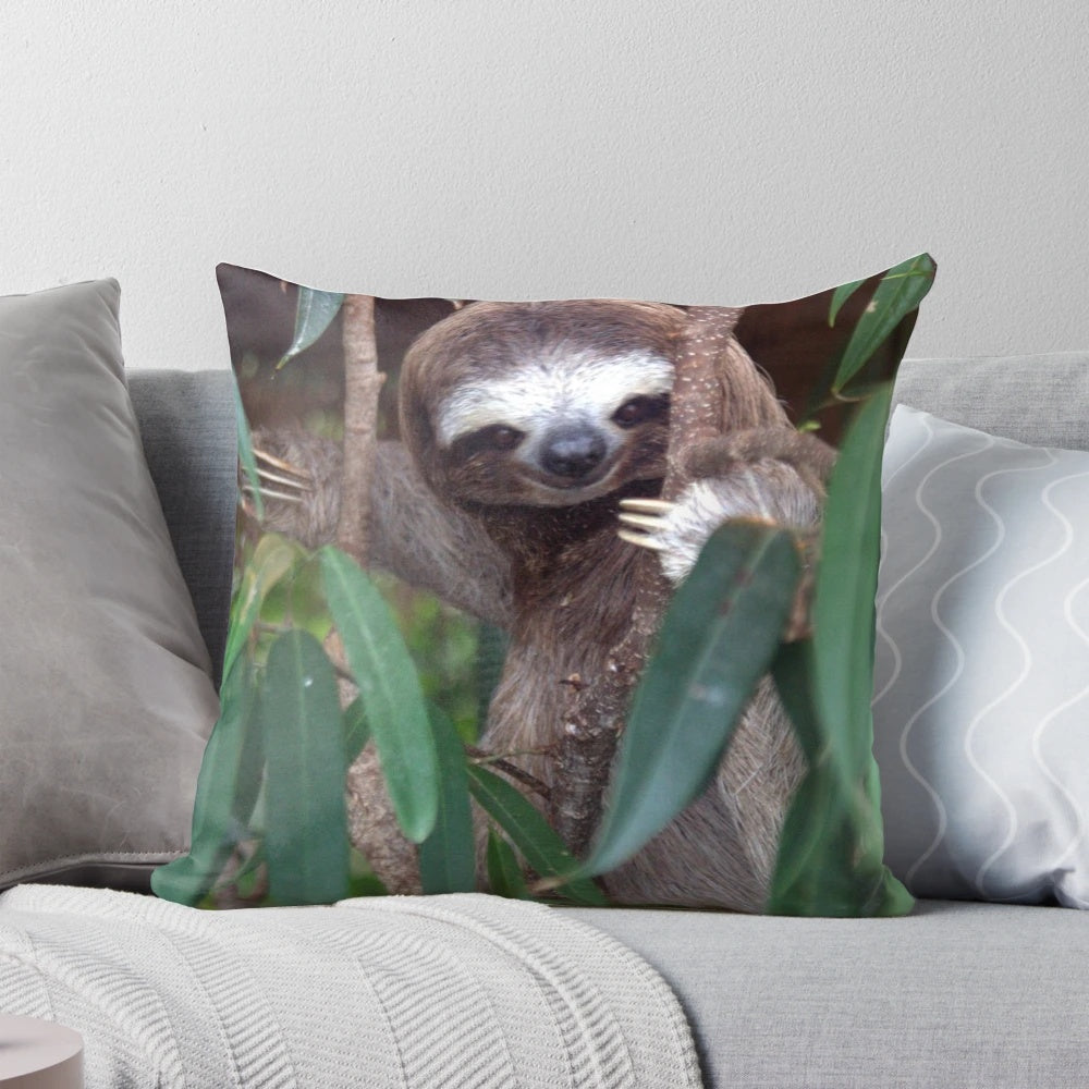 A soft, plush sloth pillow made with vegan materials, perfect for decorative and cuddle-worthy home accents.