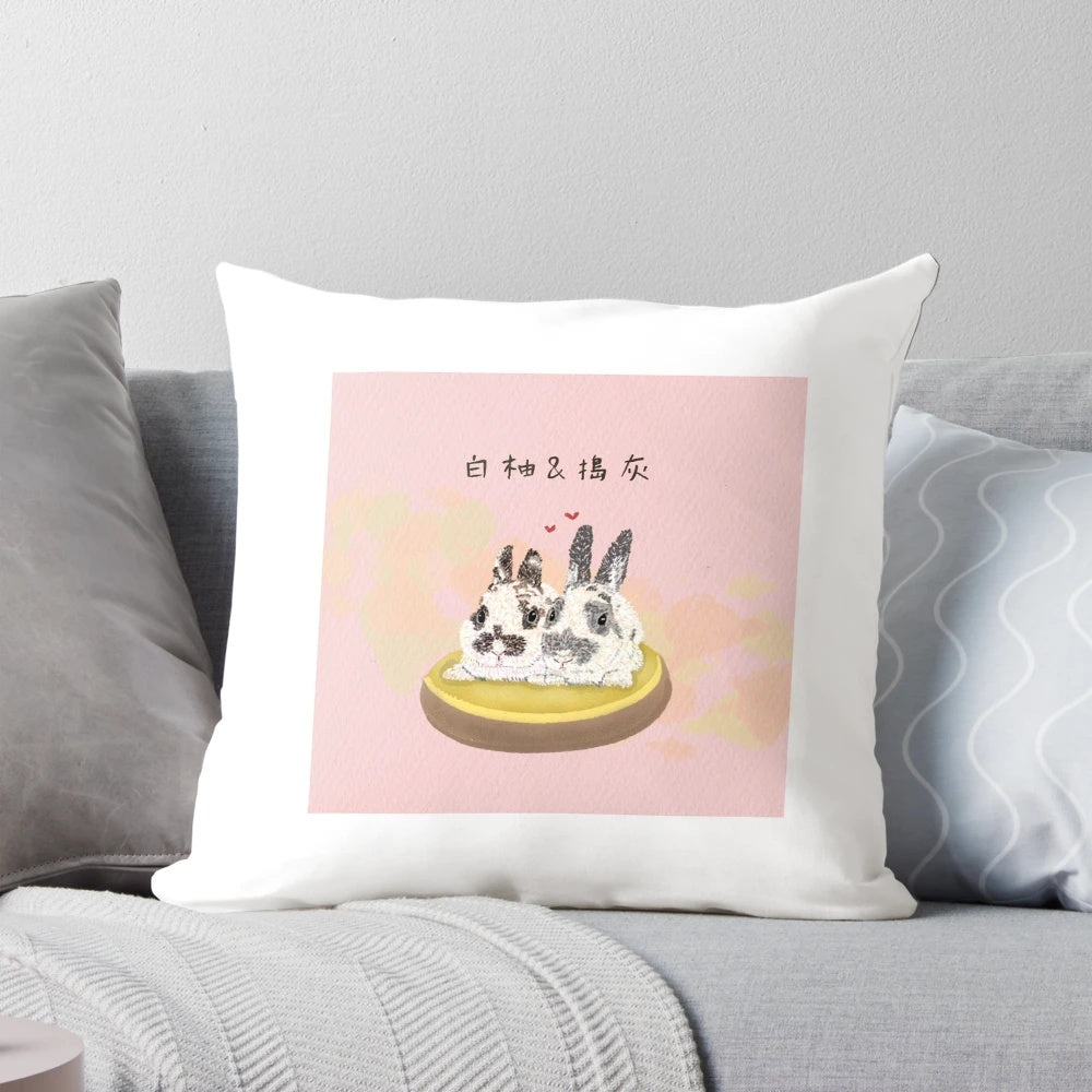 Soft and plush pillow featuring two adorable white and grey bunnies in a peaceful, snoozing pose