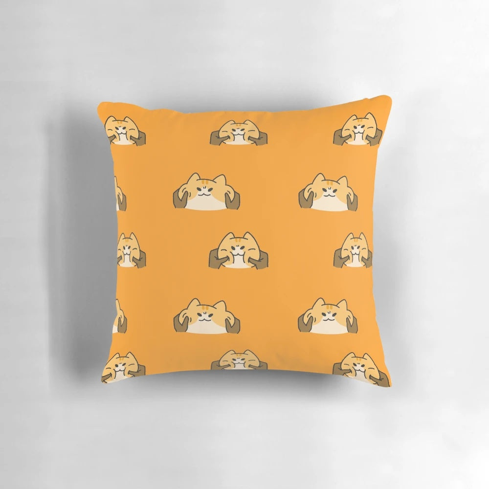 Soft, squishy orange kitten pillow with a cute, silly expression