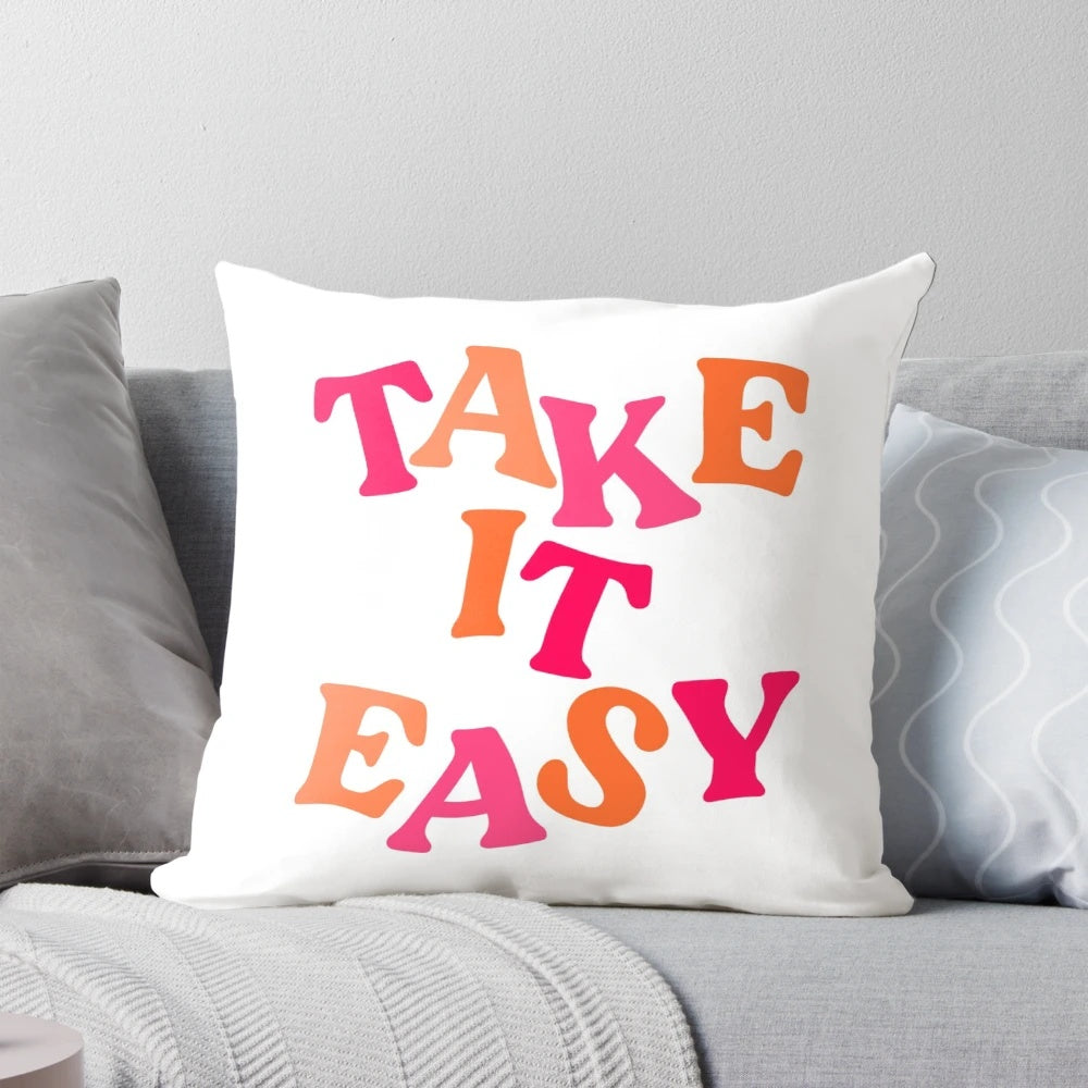 Soft and comfortable "Take It Easy" preppy-style pillow in a pink color