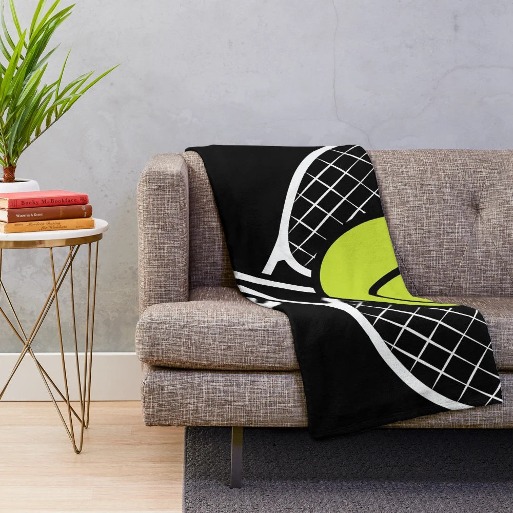 Soft and cozy plush blanket with a tennis-themed design