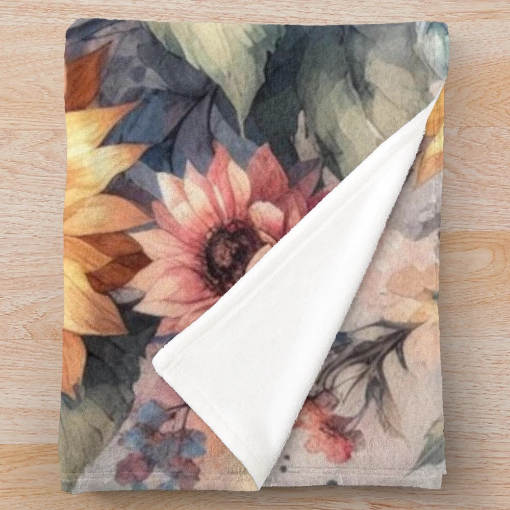 Watercolor painting of fall flowers and sunflowers on a soft plush blanket