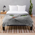 Soft white cat plush blanket with green eyes