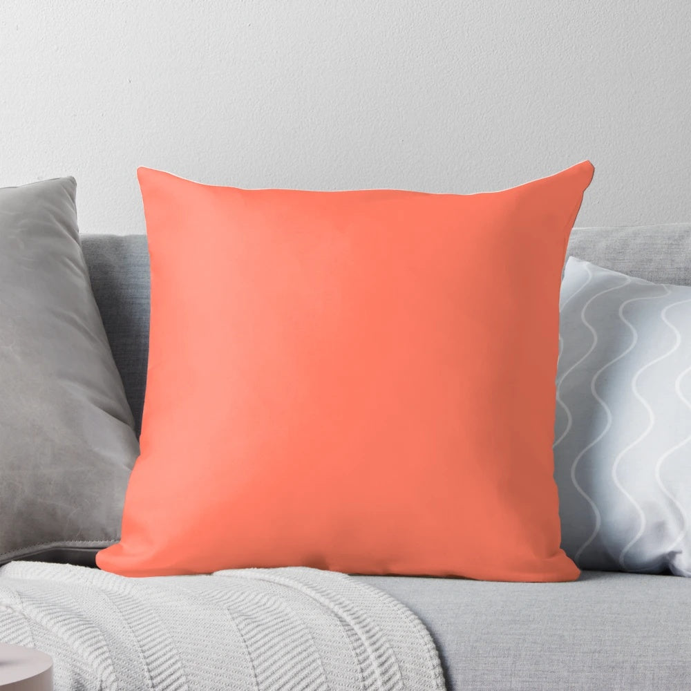 Soft and plush solid deep coral pillow for bedroom.