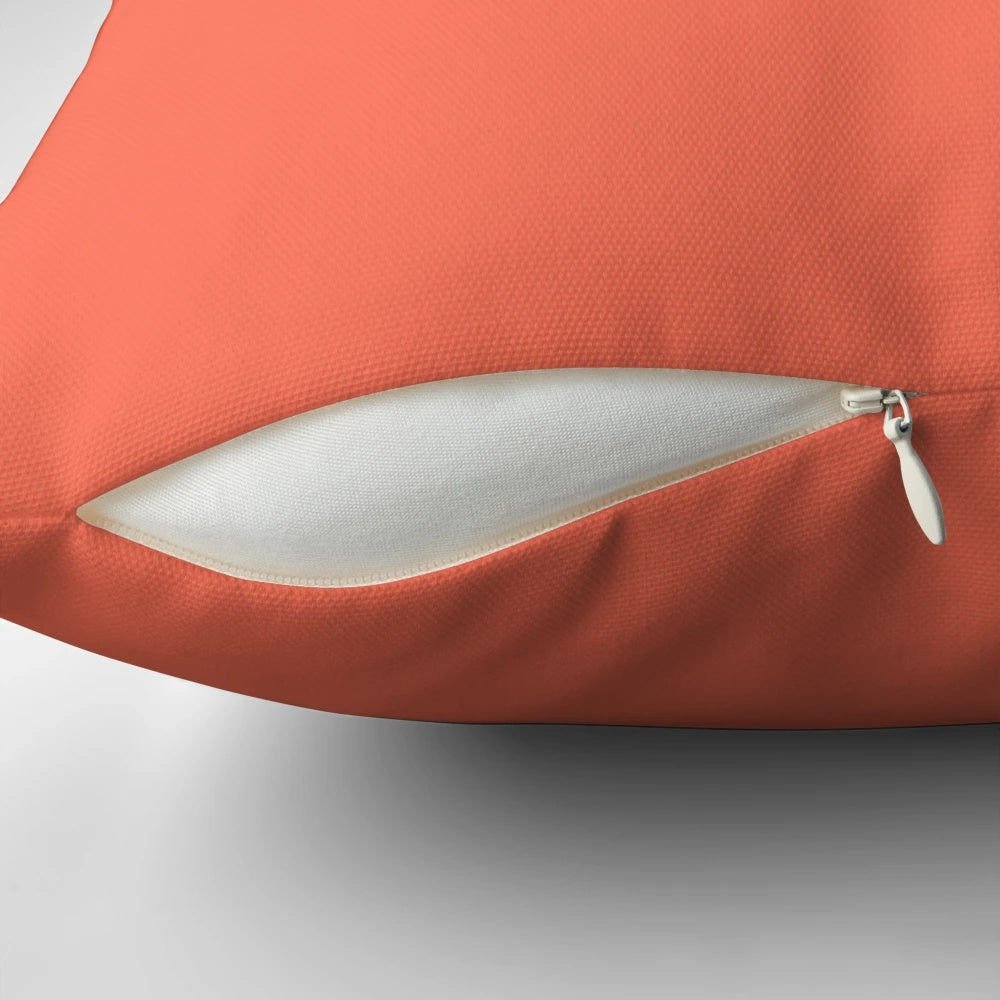 Soft and plush solid deep coral pillow for bedroom.