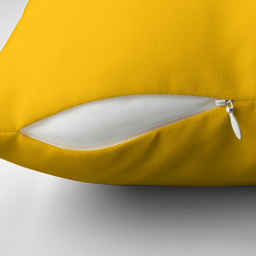Solid yellow amber colored pillow with a plain, simple design.