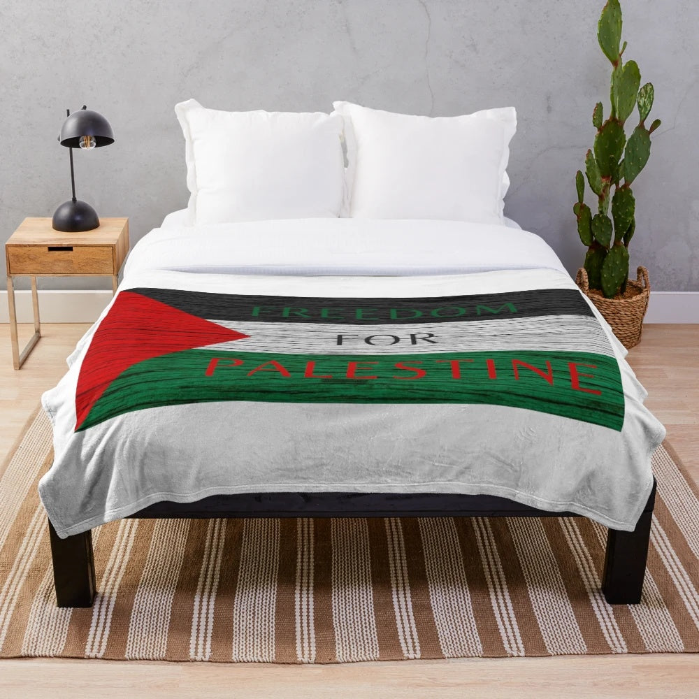 Plush blanket with the Palestinian flag and "Free Palestine" design