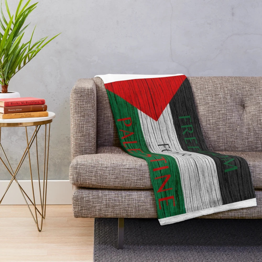 Plush blanket with the Palestinian flag and "Free Palestine" design