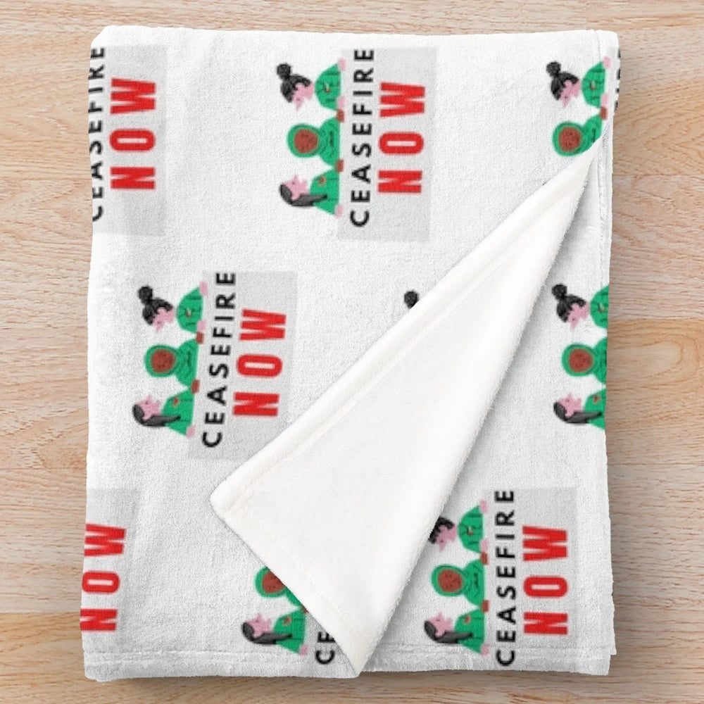 A soft, cozy plush blanket in the colors of the Palestinian flag, promoting the call for ceasefire and peace.