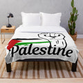 Plush blanket with Palestine flag design, supporting Palestinian freedom and human rights