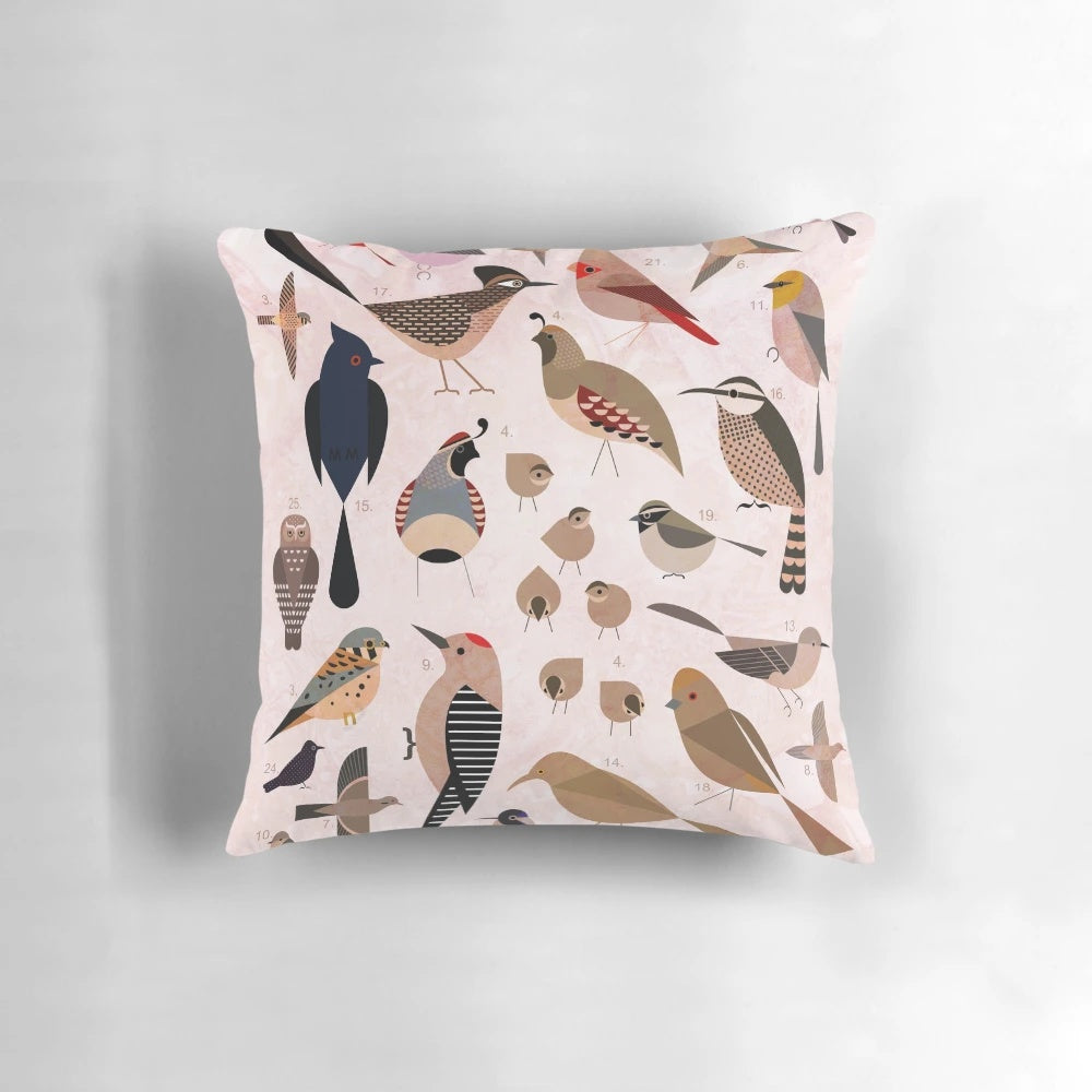 Vibrant illustration of Sonoran desert birds including an owl, quail, cardinal, and cactus wren on a decorative throw pillow