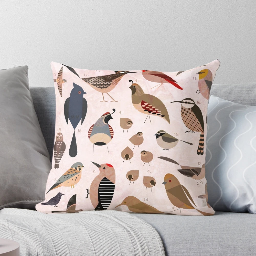 Vibrant illustration of Sonoran desert birds including an owl, quail, cardinal, and cactus wren on a decorative throw pillow