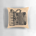 Piano accordion-shaped pillow with intricate linocut-inspired design, perfect for music lovers.