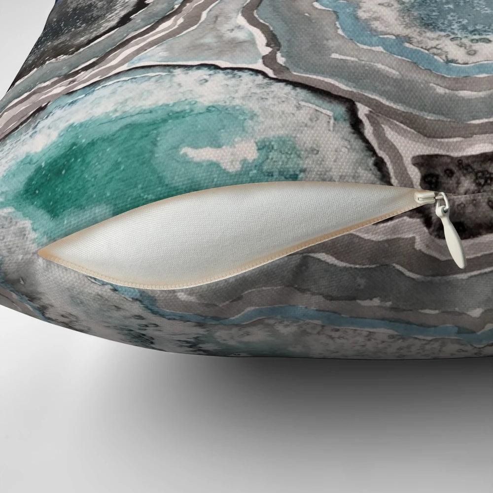 Blue teal decorative pillow with a natural, geode-inspired design