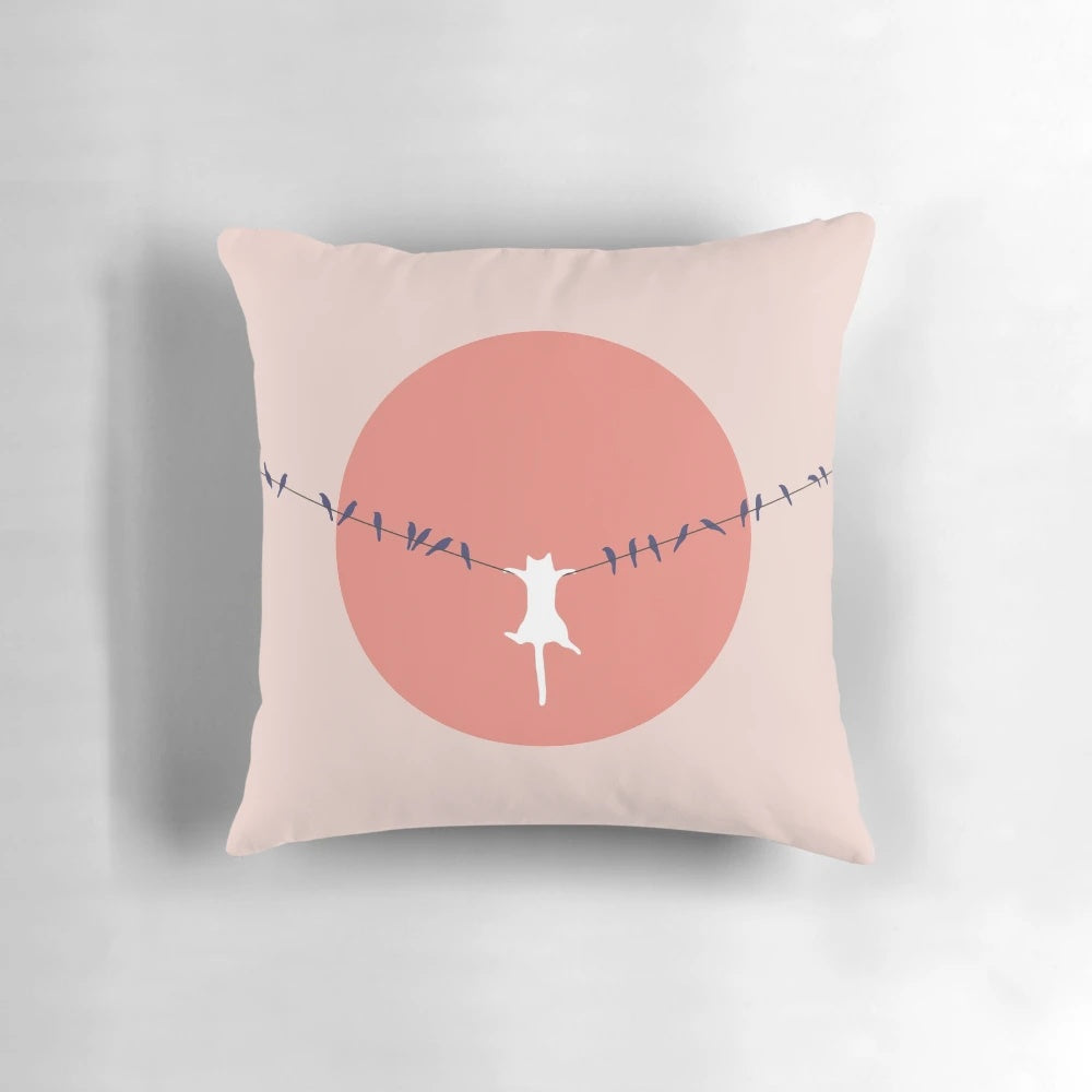 Throw pillow featuring a minimalist cat landscape design with a pink sun and calming colors