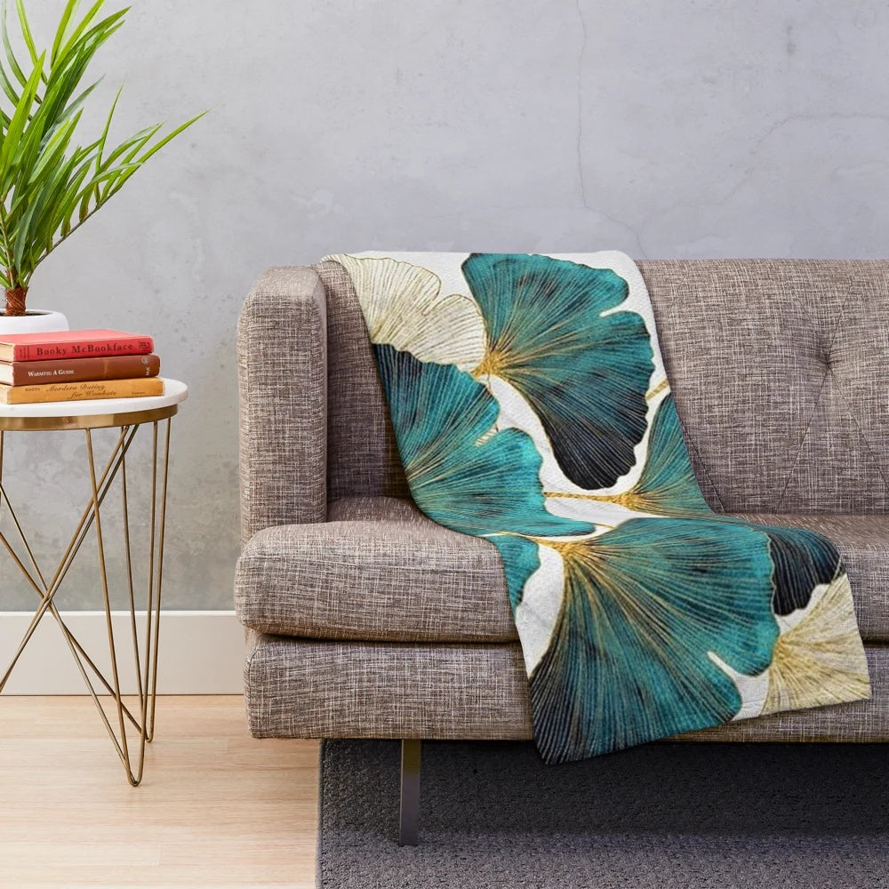 Soft, plush blanket featuring a beautiful ginkgo leaf pattern in shades of blue and yellow