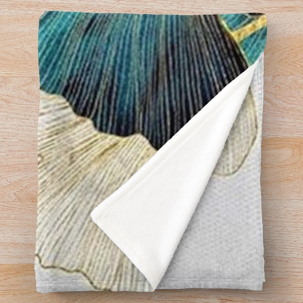 Soft, plush blanket featuring a beautiful ginkgo leaf pattern in shades of blue and yellow