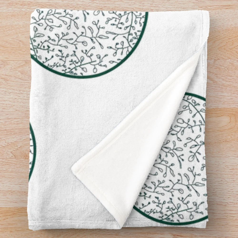 Green leaf pattern plush blanket with a botanical design