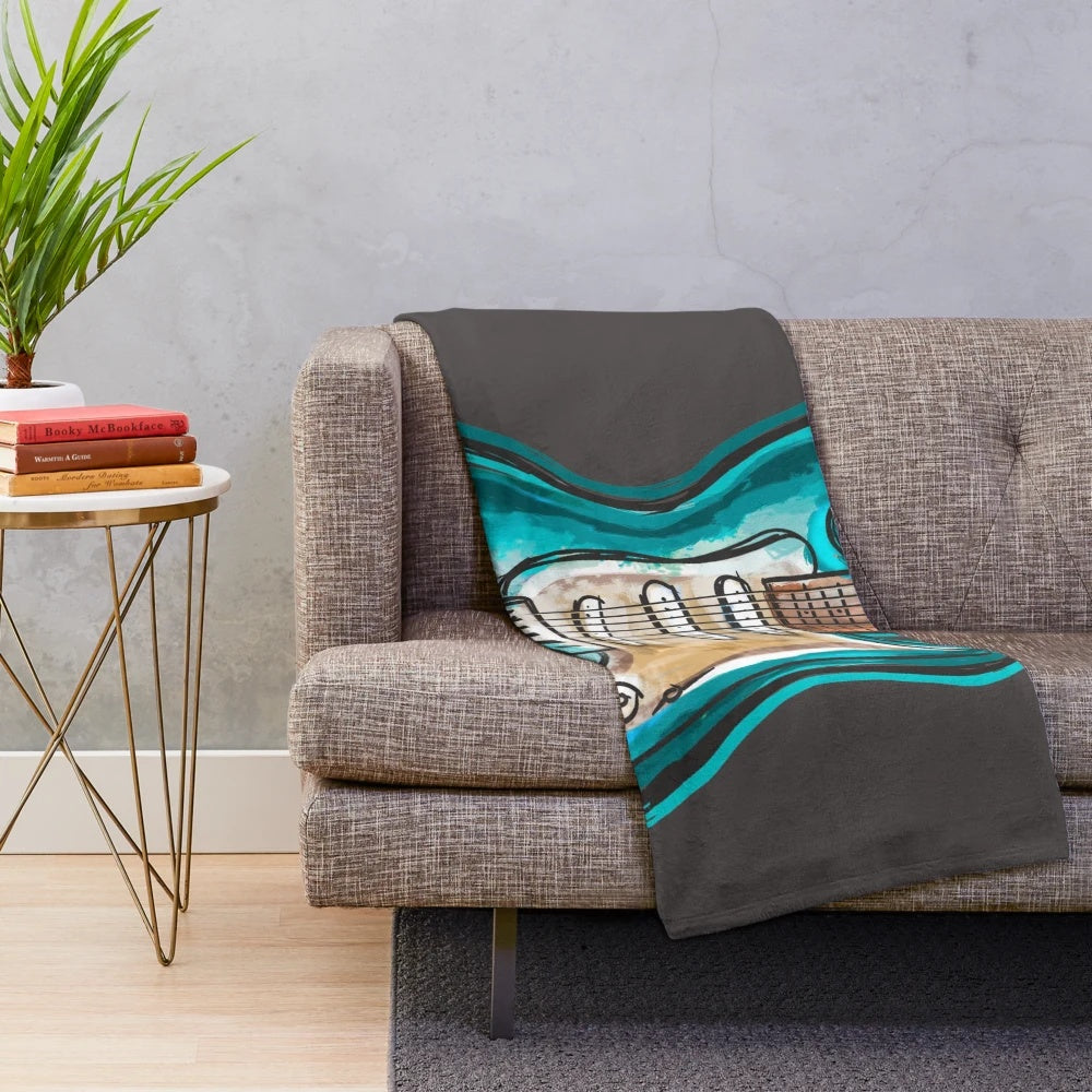 Soft and cozy plush blanket with a guitar music design