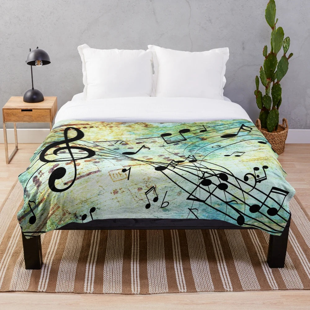 Music-themed plush blanket with musical notes and colors