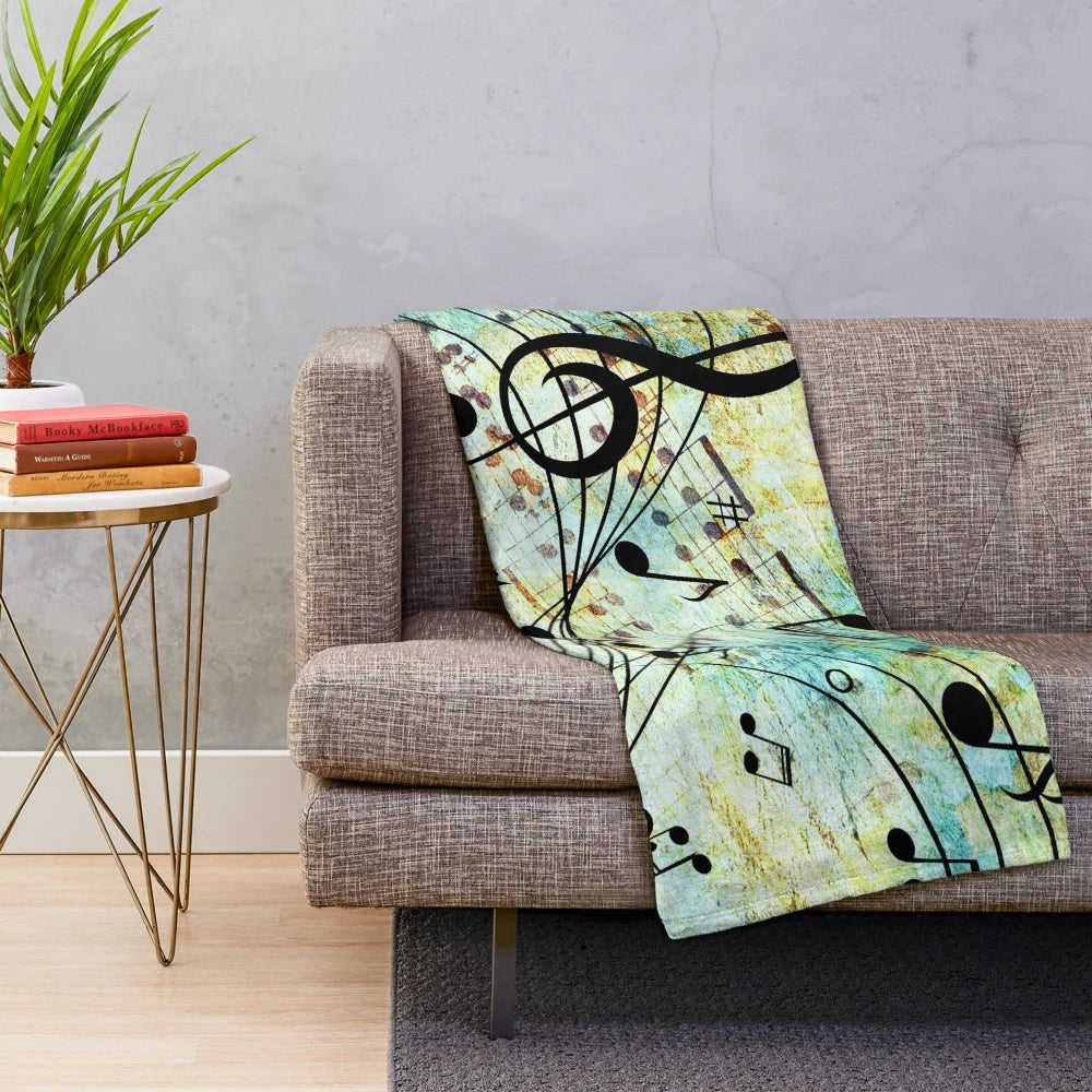 Music-themed plush blanket with musical notes and colors