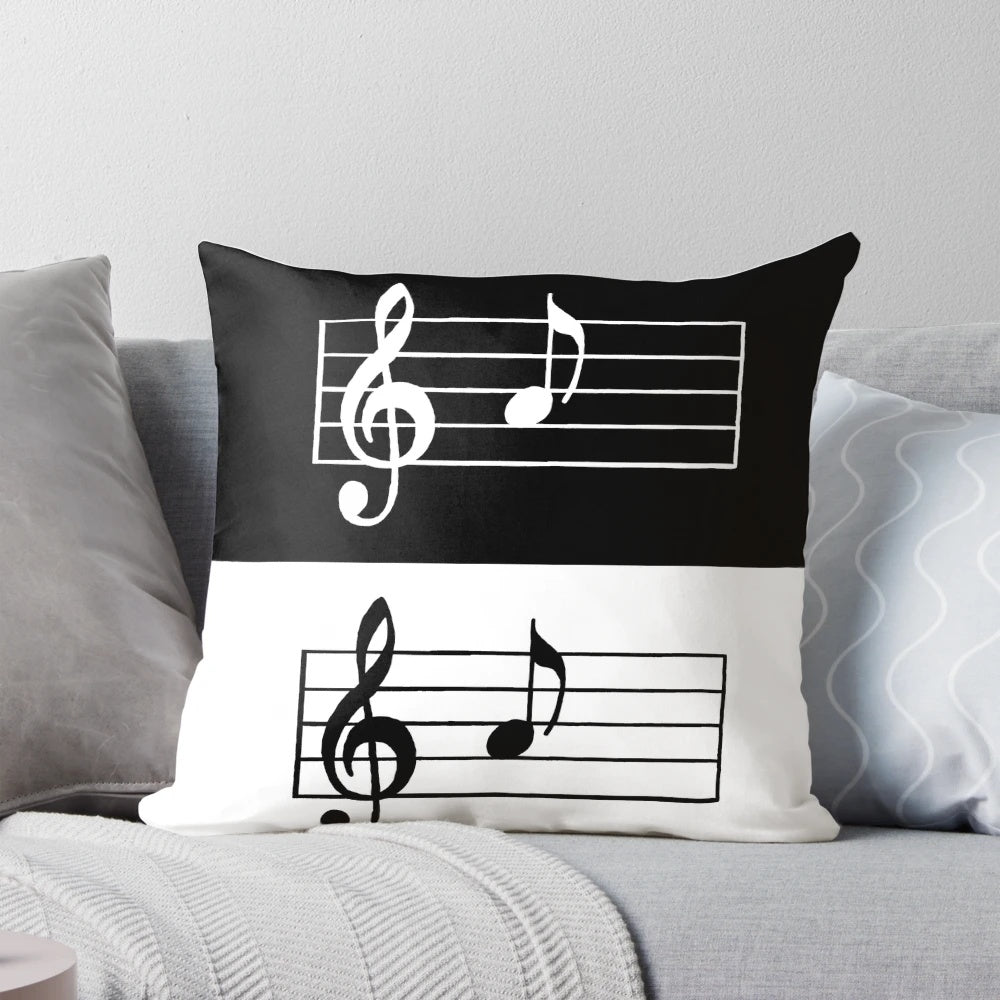 A black and white pillow featuring a simple musical note design, perfect for music lovers and minimalist decor.