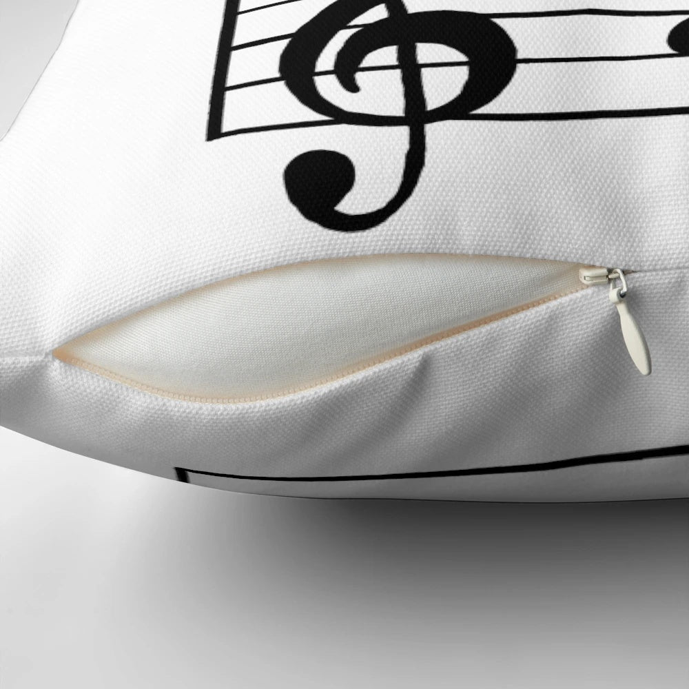 A black and white pillow featuring a simple musical note design, perfect for music lovers and minimalist decor.