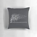 A white pillow with an artistic design featuring nature sounds and musical notes