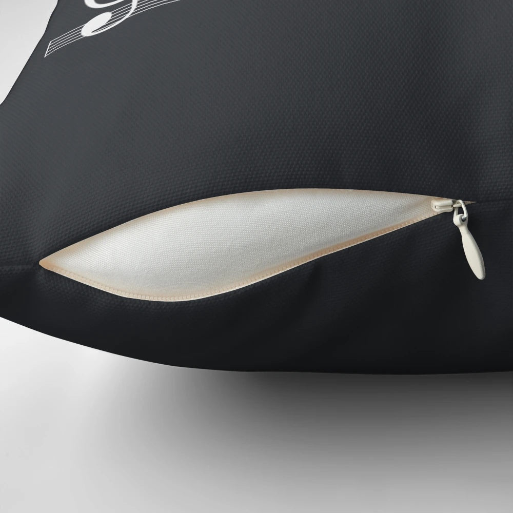 A white pillow with an artistic design featuring nature sounds and musical notes