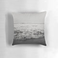 A plush and comfortable pillow featuring a vibrant ocean wave design