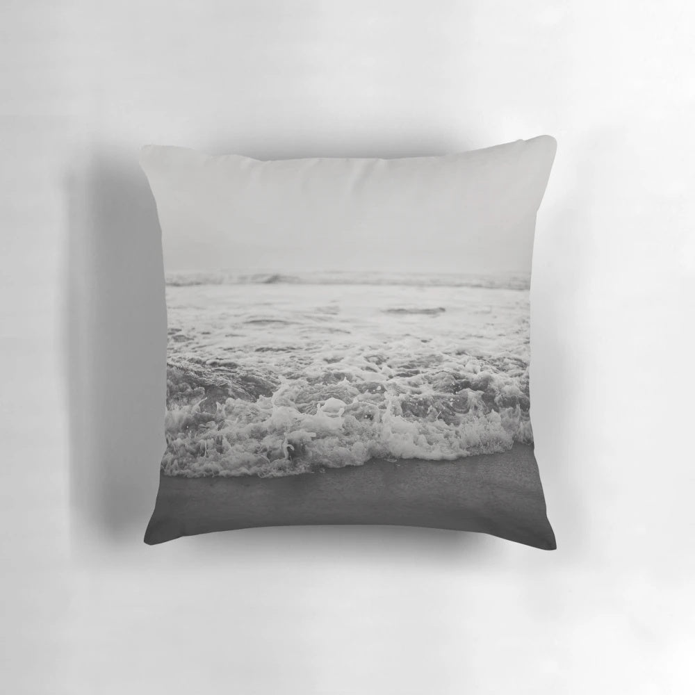 A plush and comfortable pillow featuring a vibrant ocean wave design