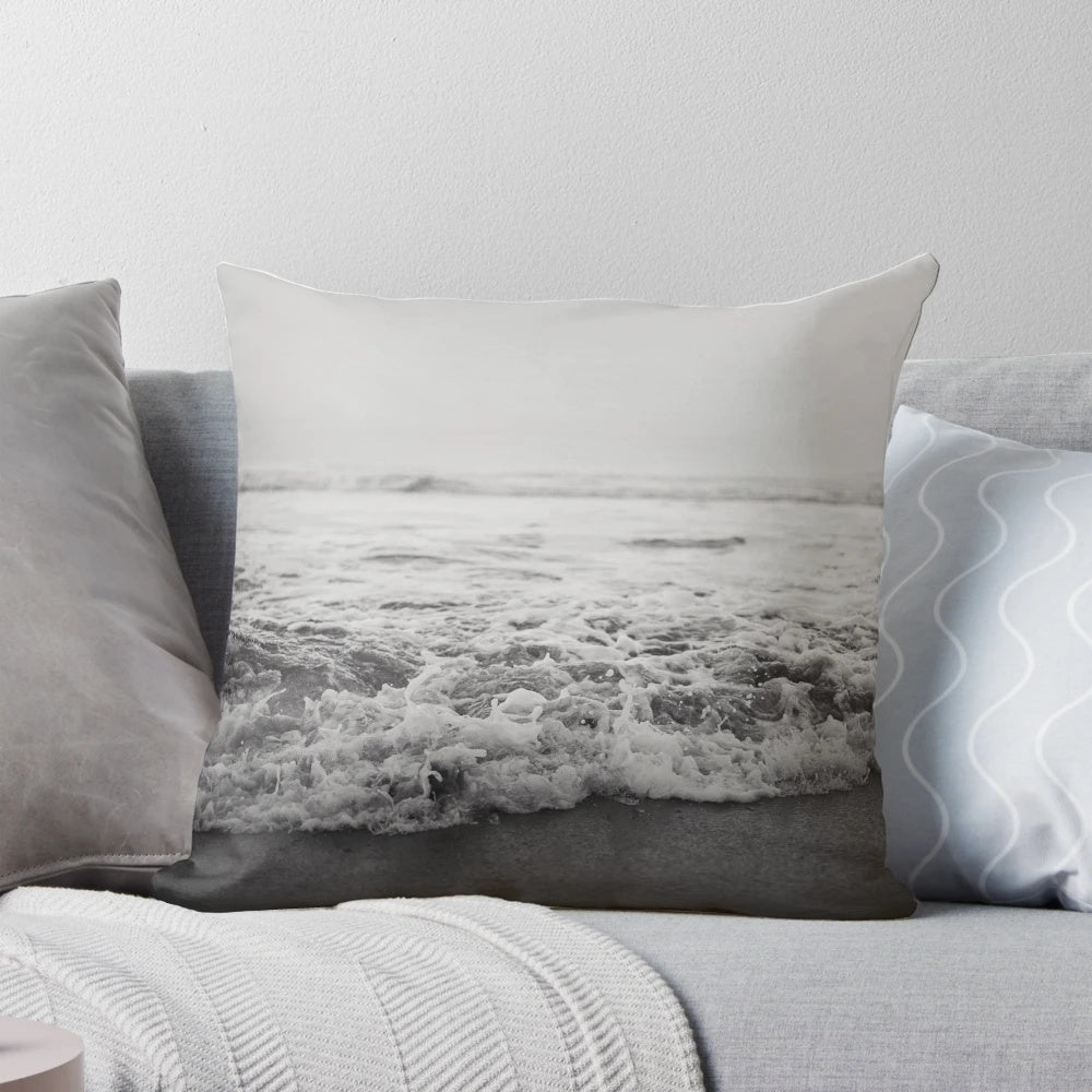 A plush and comfortable pillow featuring a vibrant ocean wave design
