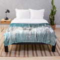 Abstract plush blanket with ocean teal and blue waves design