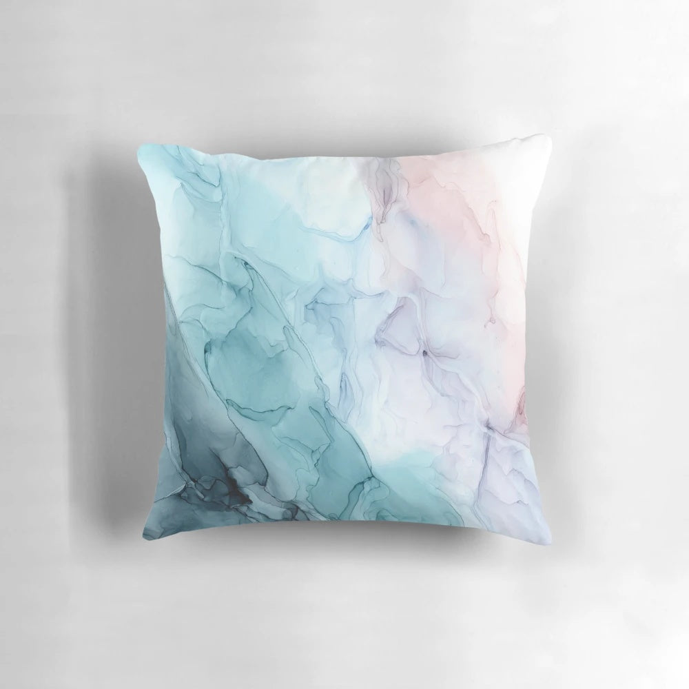 Soft and flowing abstract art pillow in pastel shades of pink and grey