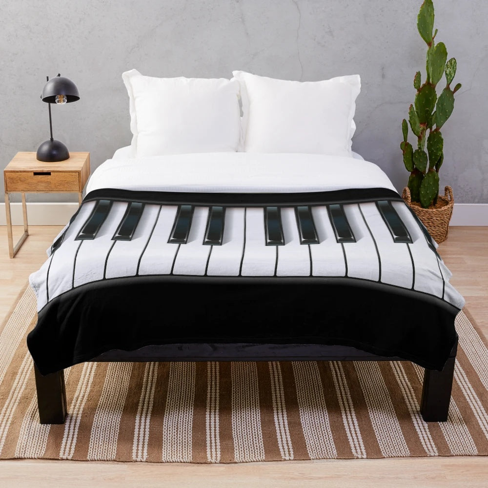 Piano-themed plush blanket
