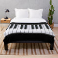 Piano-themed plush blanket