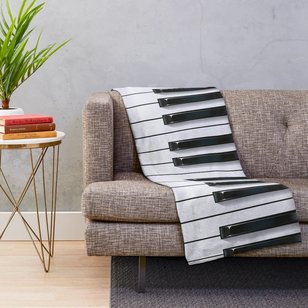 Piano-themed plush blanket