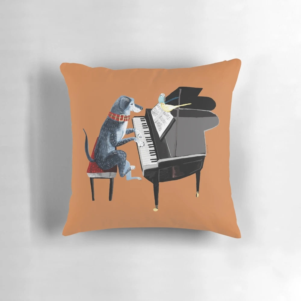 Blue dog angel pillow with musician playing the piano