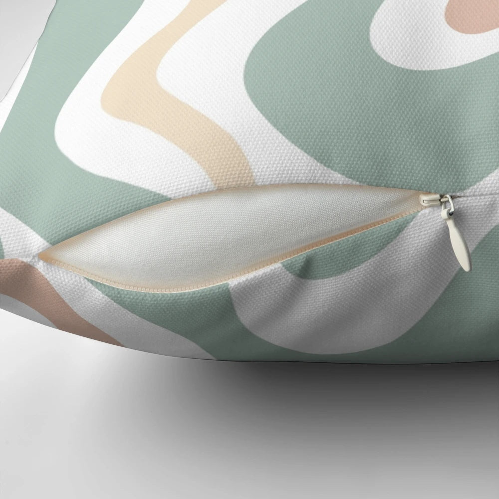 Soothing abstract pillow in light sage celadon green, light blush, and cream colors with a retro, swirling pattern