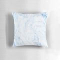 A cozy, sky blue marble-patterned pillow with a soft, watercolor-like design.