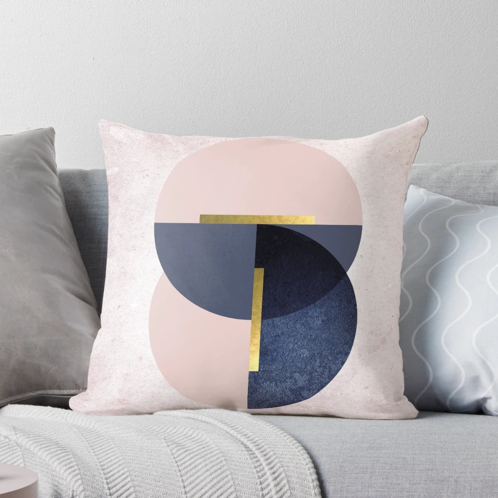 Overlapping circles pillow in pastel pink and navy blue, featuring a minimalist geometric design.