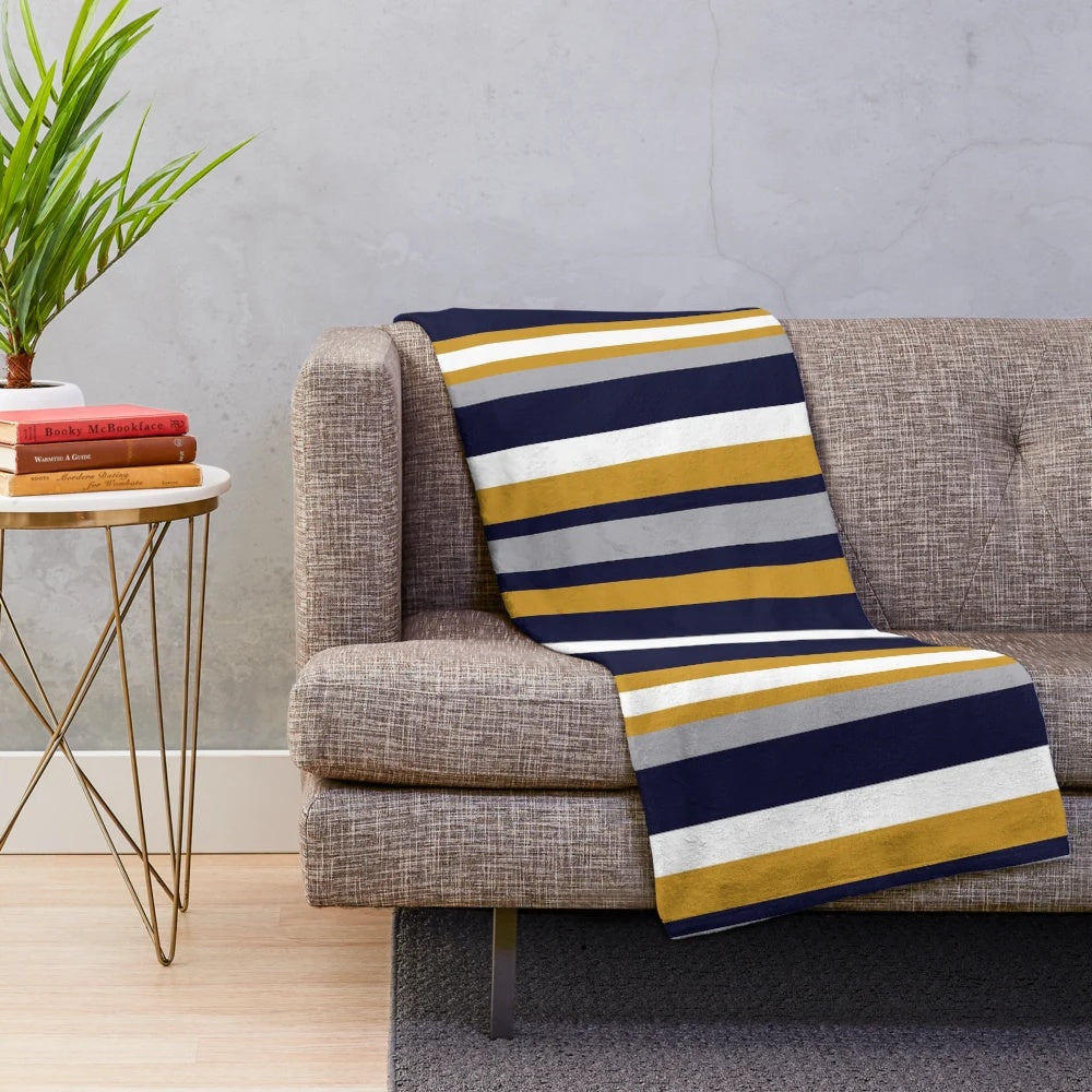 Vertical stripe plush blanket in mustard, navy, and gray colors